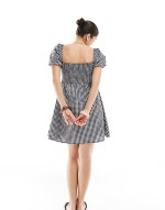 Exclusive mini puff sve beach dress in black and white gingham